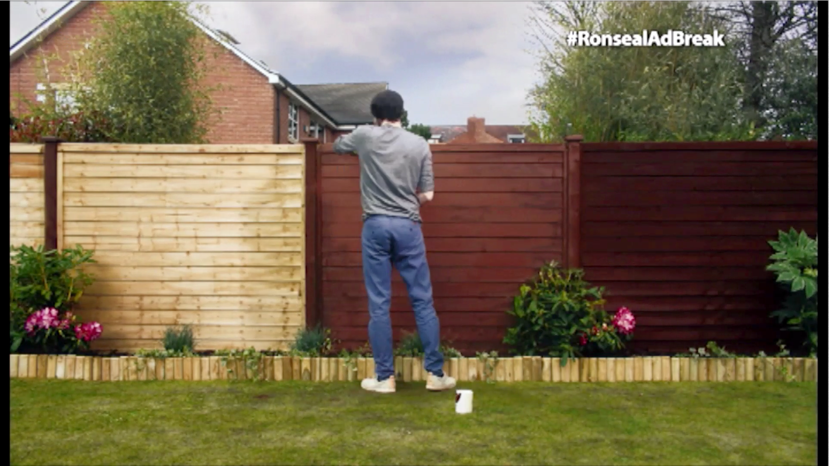 The man featured in the humorous advert pictured painting his fence